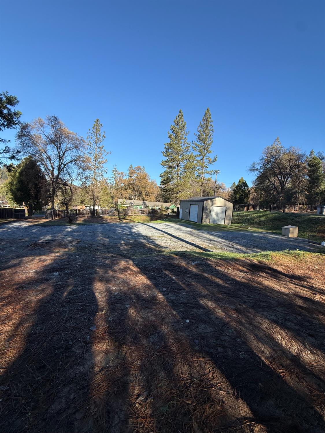 4876 Black Oak Mine Road Garden Valley, CA 95633 - Photo 25 of 31 a view of a street with a building in the background