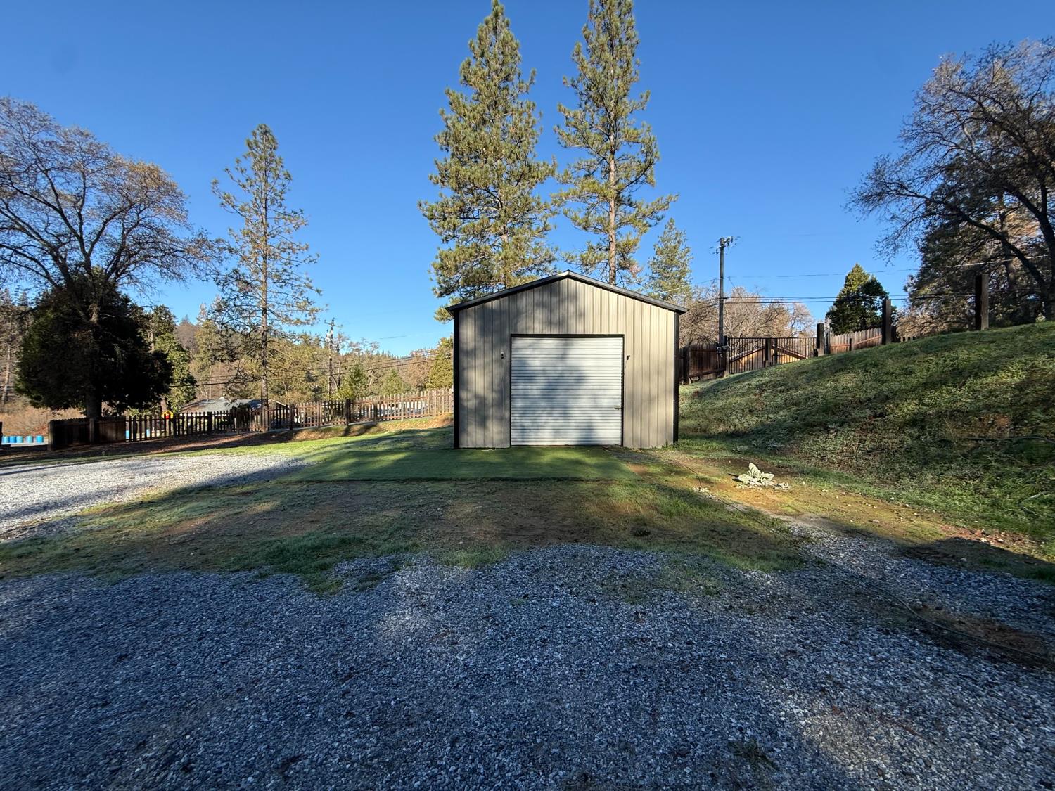 4876 Black Oak Mine Road Garden Valley, CA 95633 - Photo 3 of 31 a view of a yard with a house
