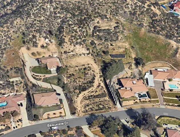 a view of a town with mountains in the background