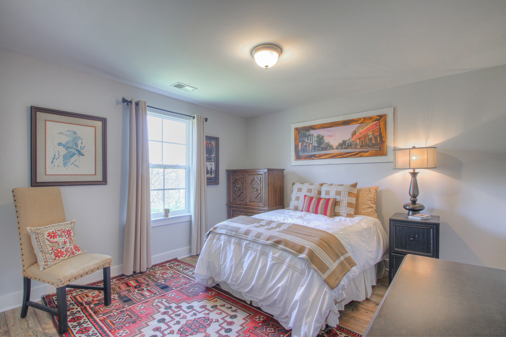 5042 Gracious Drive Franklin, TN 37064 - Photo 12 of 14 a bedroom with a bed and a lamp on table