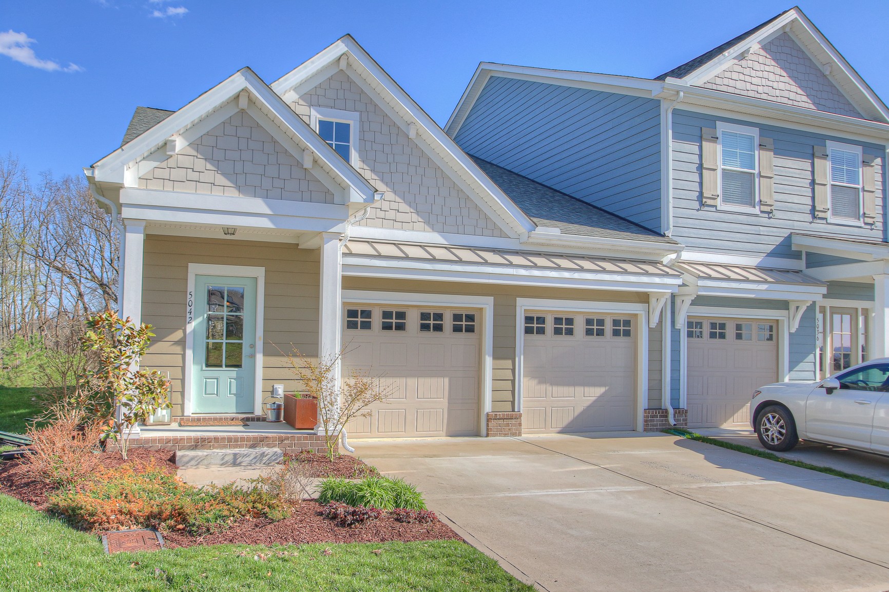 5042 Gracious Drive Franklin, TN 37064 - Photo 14 of 14 a front view of a house with a garden and plants