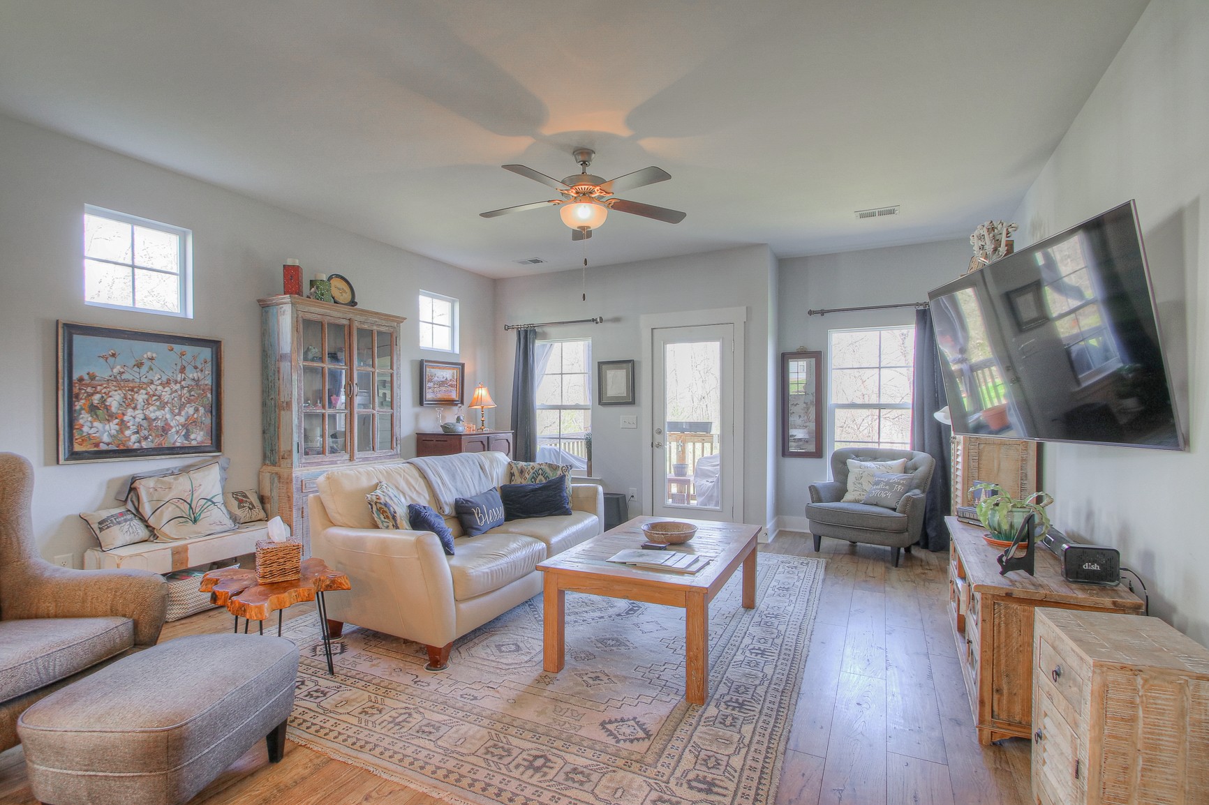5042 Gracious Drive Franklin, TN 37064 - Photo 5 of 14 a living room with furniture a flat screen tv and wooden floor