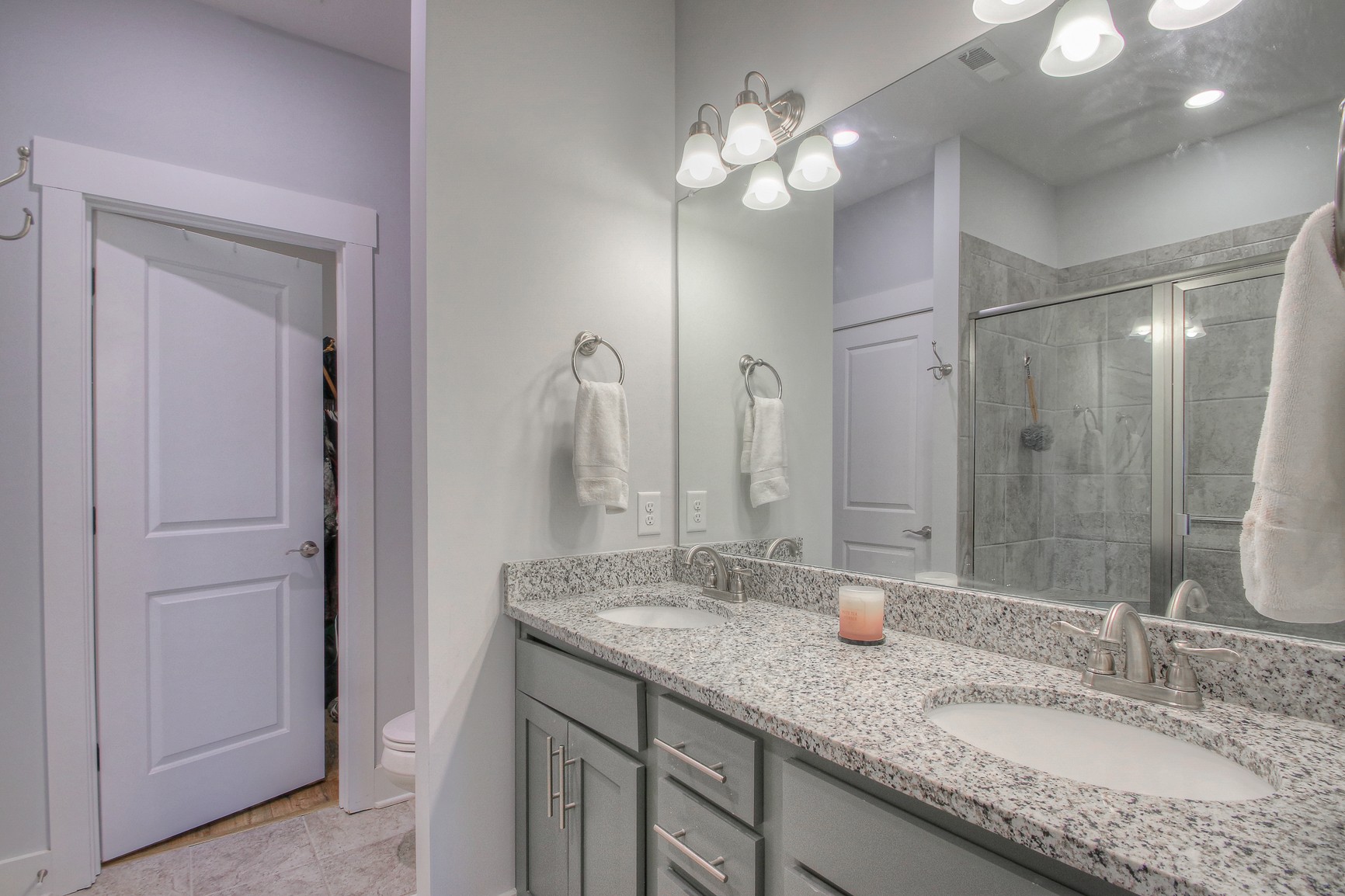 5042 Gracious Drive Franklin, TN 37064 - Photo 7 of 14 a bathroom with a granite countertop double vanity sink and a mirror