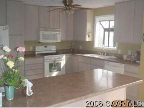 1177 Barrenridge Road Fishersville, VA 22939 - Photo 6 of 12 a kitchen with kitchen island a sink stainless steel appliances and cabinets