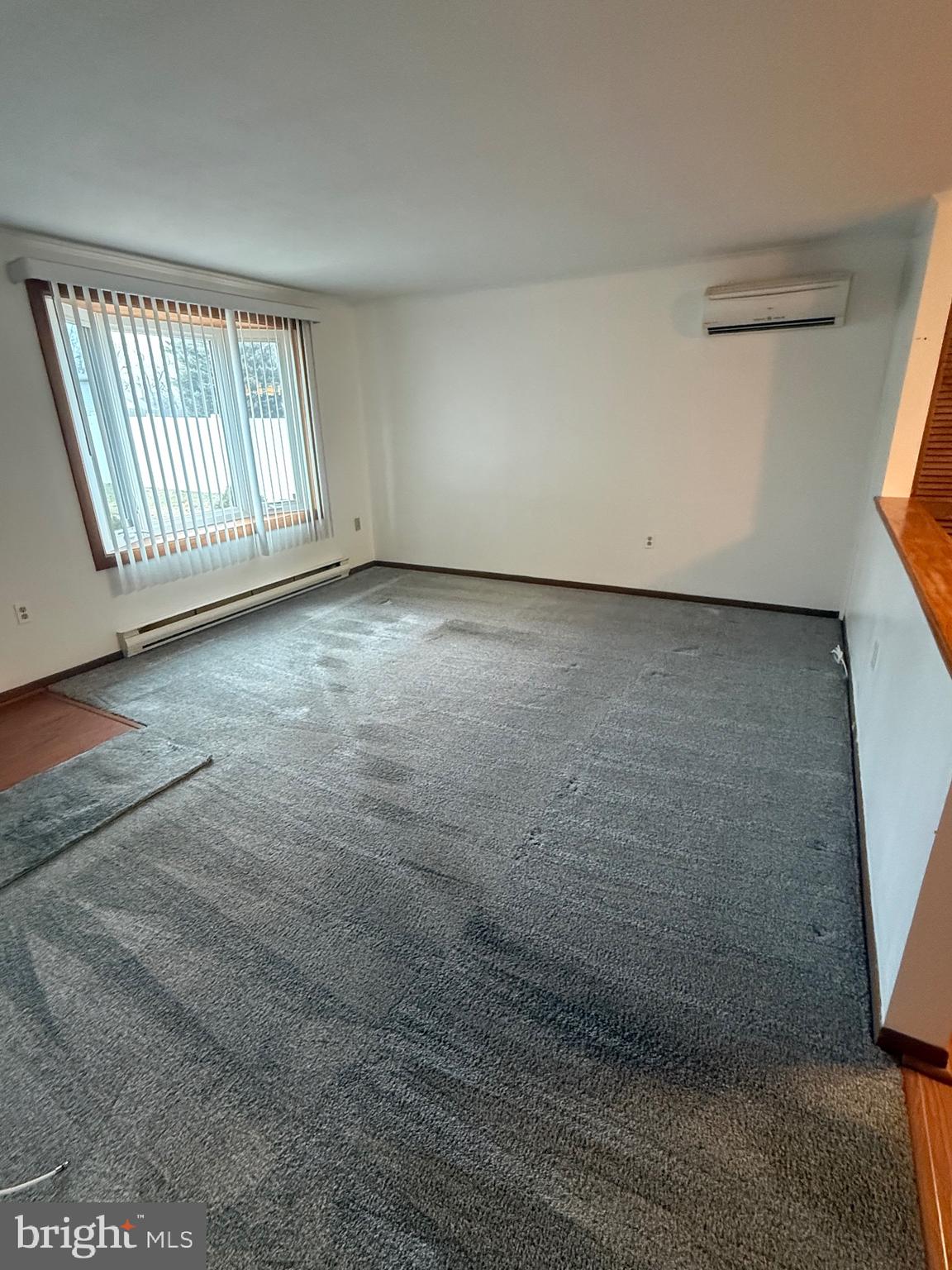 1521 Hickstown Road Sicklerville, NJ 08081 - Photo 5 of 28 a view of an empty room with a window