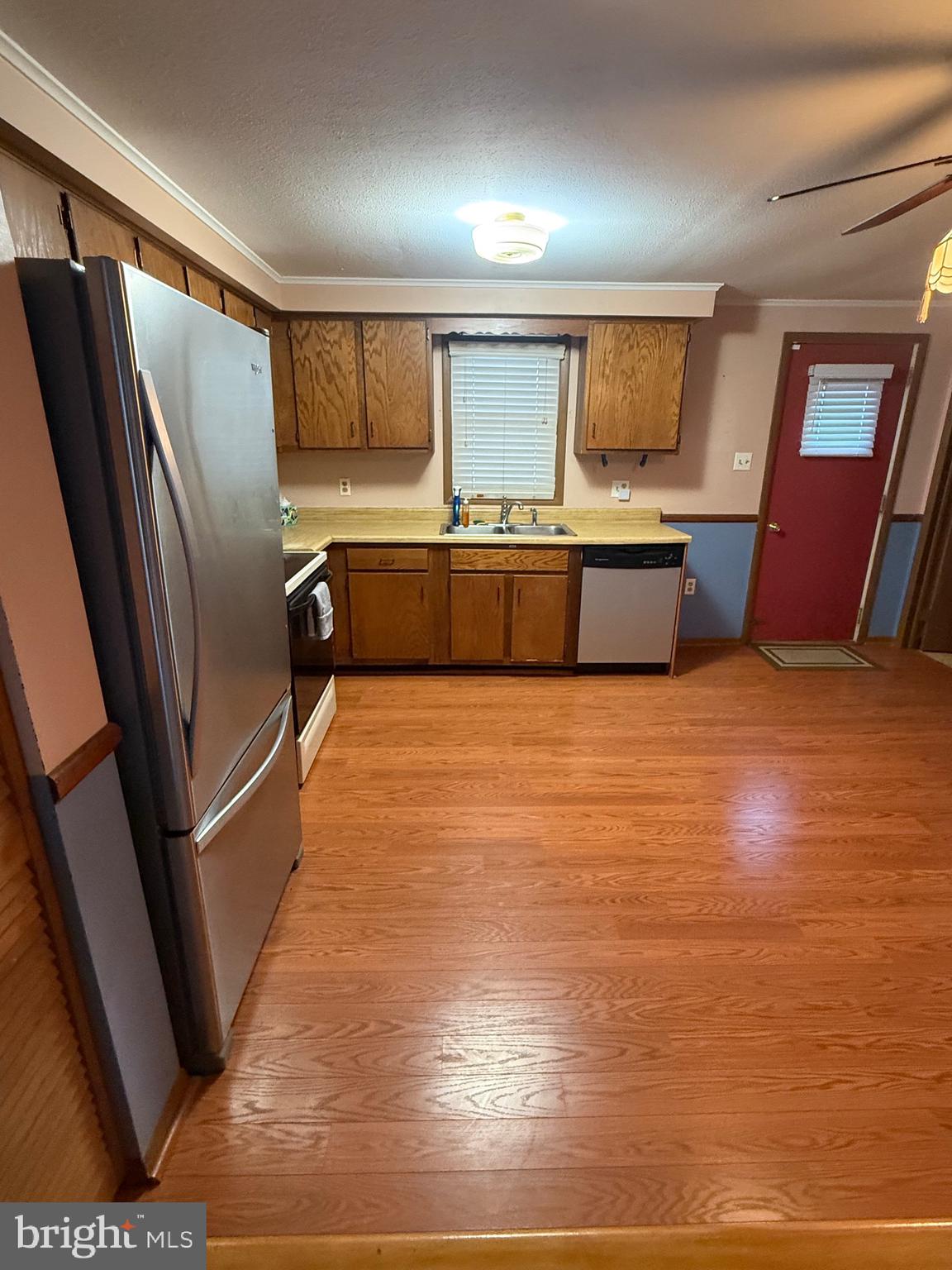 1521 Hickstown Road Sicklerville, NJ 08081 - Photo 8 of 28 a kitchen with stainless steel appliances a refrigerator and a sink