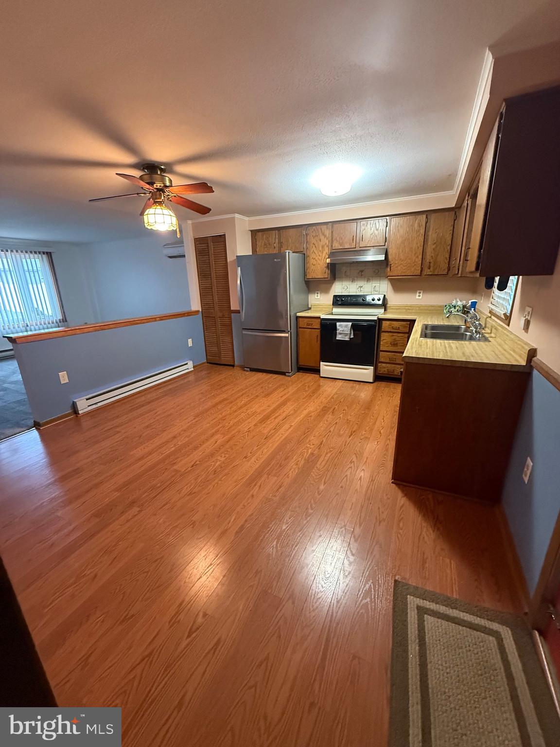 1521 Hickstown Road Sicklerville, NJ 08081 - Photo 9 of 28 a view of kitchen with furniture and wooden floor
