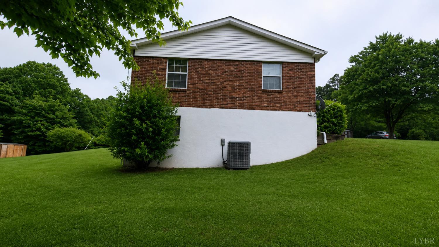 2346 Mitchell Mill Road Gladys, VA 24554 - Photo 25 of 38 a front view of house with a garden