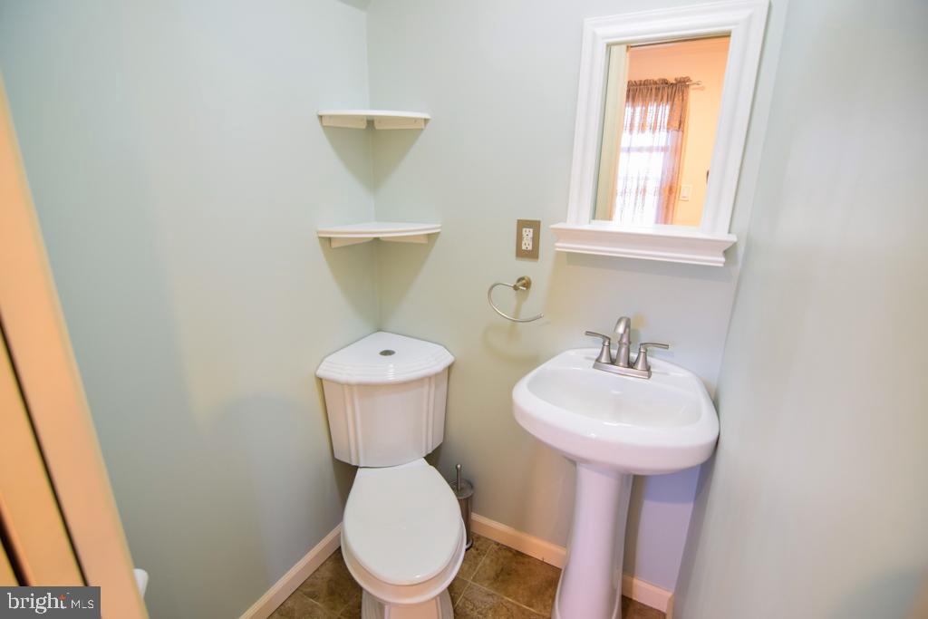 1071 West Bristol Road Warminster, PA 18974 - Photo 11 of 34 a bathroom with a sink toilet and a mirror