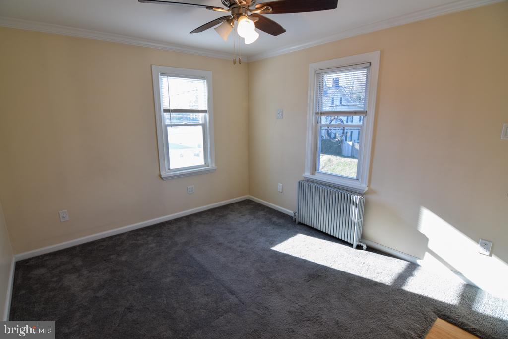 1071 West Bristol Road Warminster, PA 18974 - Photo 14 of 34 an empty room with windows and fan