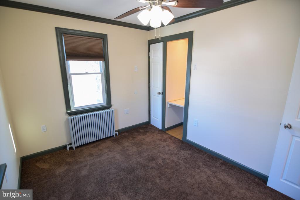 1071 West Bristol Road Warminster, PA 18974 - Photo 16 of 34 an empty room with a window and chandelier