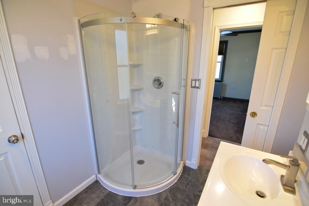 1071 West Bristol Road Warminster, PA 18974 - Photo 19 of 34 a bathroom with a shower and a sink