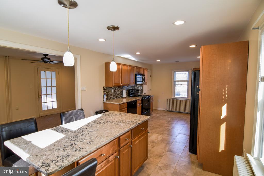 1071 West Bristol Road Warminster, PA 18974 - Photo 2 of 34 a kitchen with stainless steel appliances granite countertop a sink refrigerator and stove