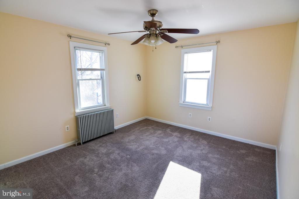 1071 West Bristol Road Warminster, PA 18974 - Photo 28 of 34 an empty room with windows and fan