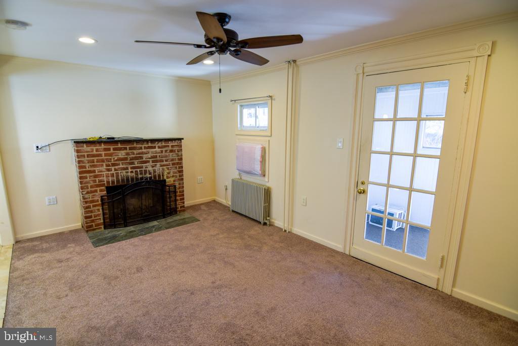 1071 West Bristol Road Warminster, PA 18974 - Photo 8 of 34 a view of an empty room with a fireplace and a window