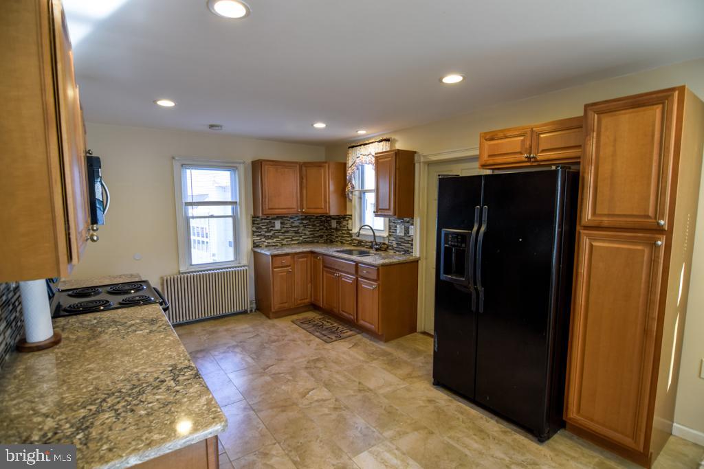 1071 West Bristol Road Warminster, PA 18974 - Photo 10 of 34 a kitchen with a refrigerator and a sink