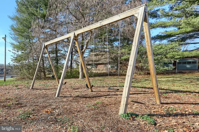 a bathroom with a sink vanity mirror and toilet
