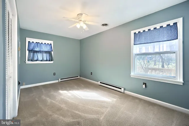 a view of a lake with houses in the back