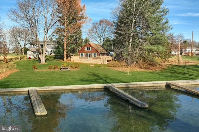 an aerial view of a houses with ocean view