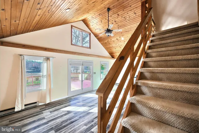 a view of a lake with houses in the back