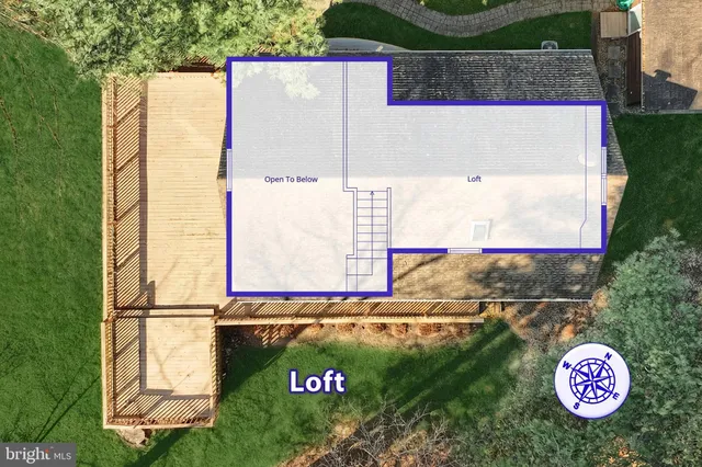 a view of a lake with houses in the background