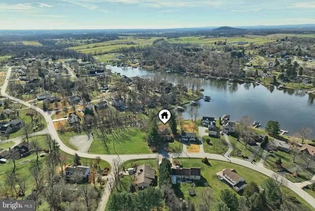 a view of a lake with houses in the back