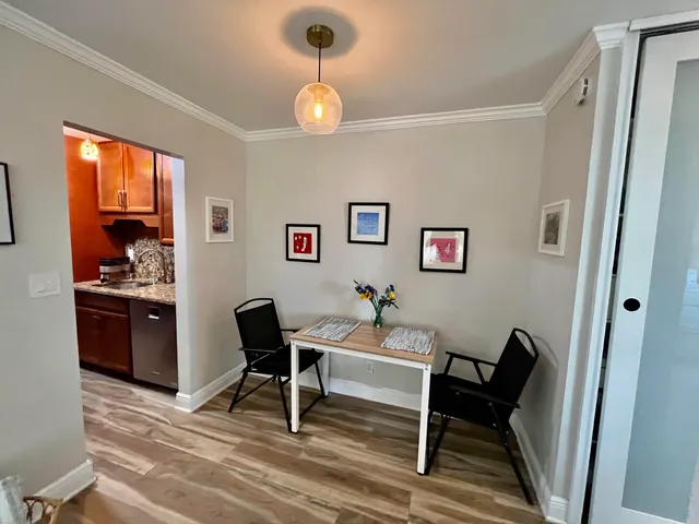 a work room with furniture and a window