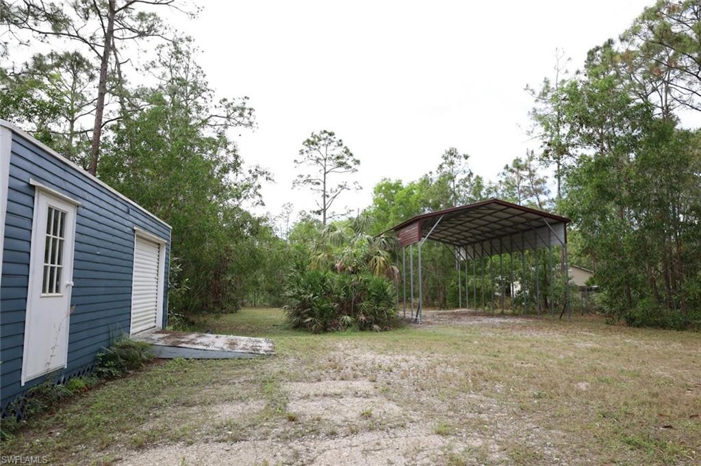 4295 14th Street Northeast Naples, FL 34120 - Photo 21 of 23 View of yard with a carport