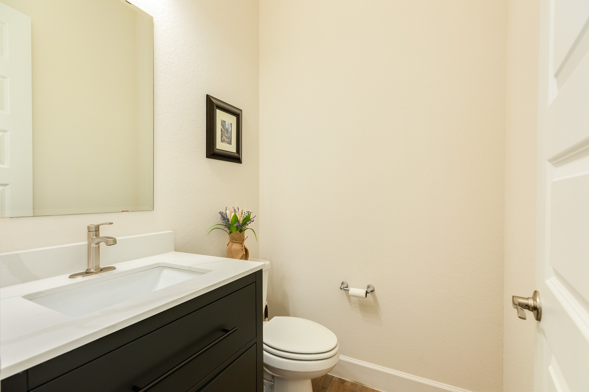 9538 Sanger Way Manvel, TX 77578 - Photo 13 of 50 The half bath for your guests is conveniently located on the right side of the hallway, providing easy access and privacy for visitors.
