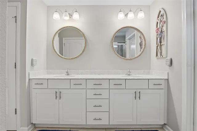 a view of walk in closet with clothes