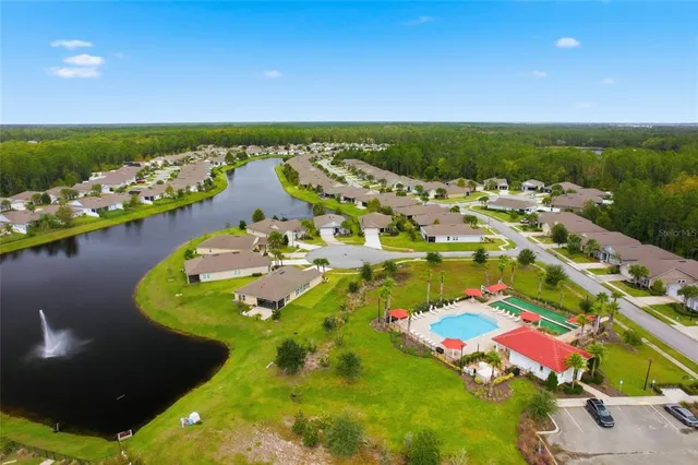 a view of a dining room with furniture wooden floor and chandelier