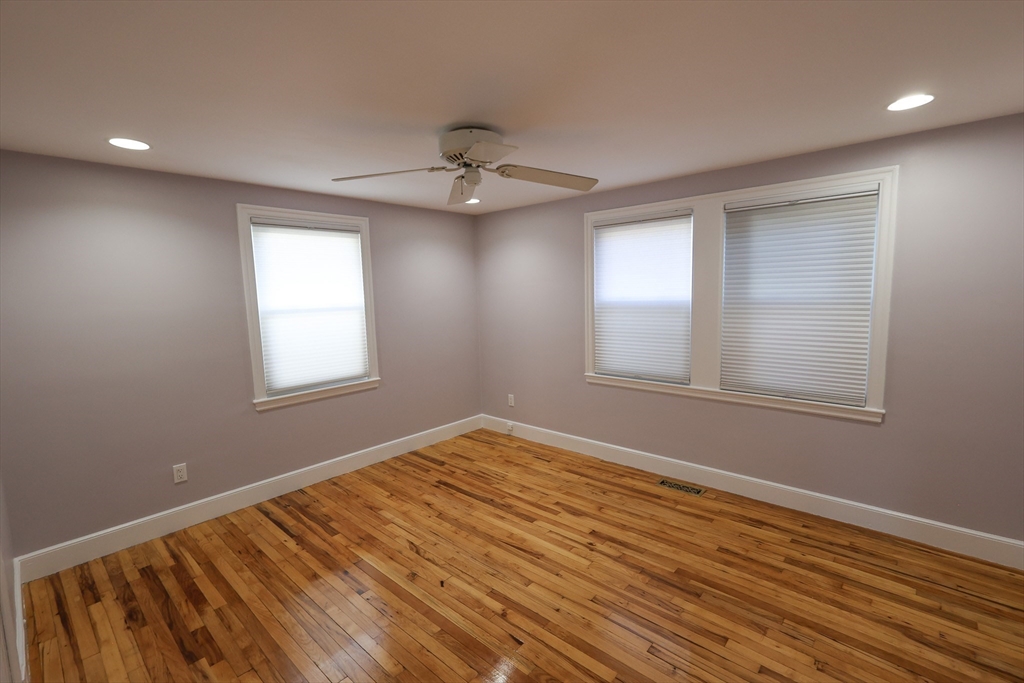33 Paragon Road, Unit 1 Boston, MA 02132 - Photo 18 of 20 wooden floor in an empty room with a window