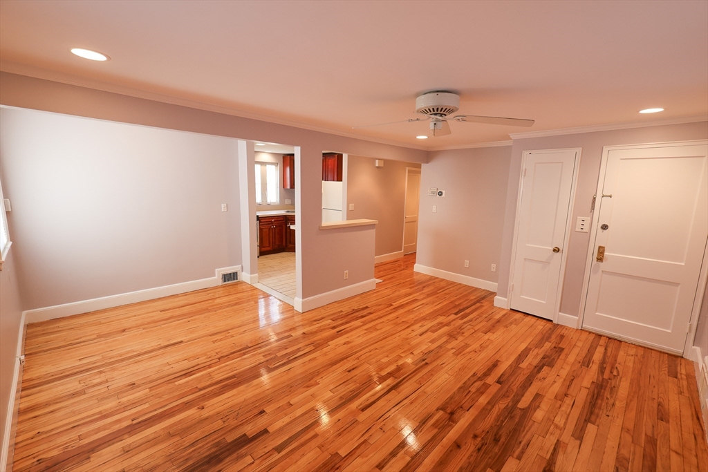 33 Paragon Road, Unit 1 Boston, MA 02132 - Photo 6 of 20 a view of empty room with wooden floor and fan