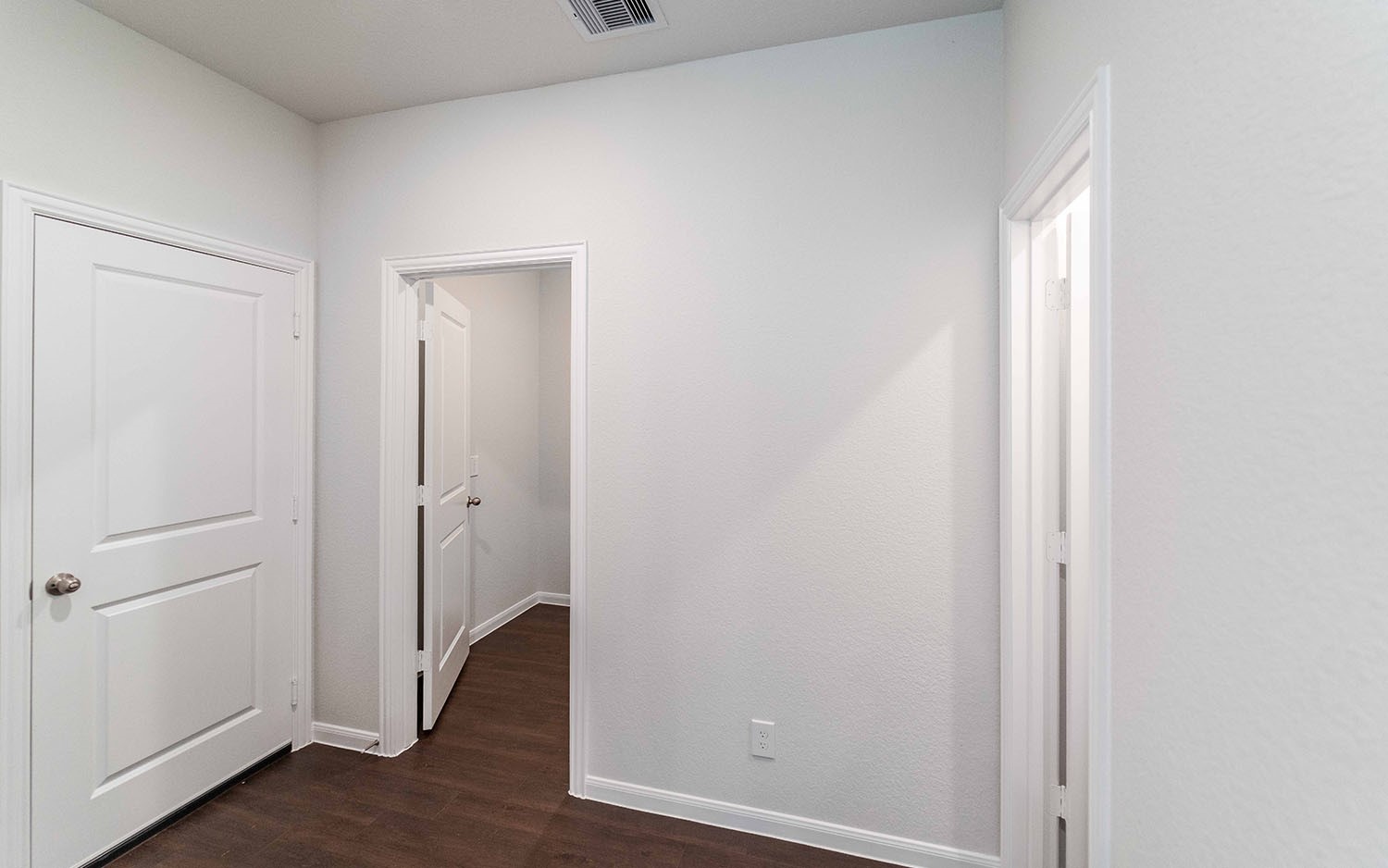 4315 Maple Root Lane Pinehurst, TX 77362 - Photo 17 of 27 a view of a hallway with wooden floor
