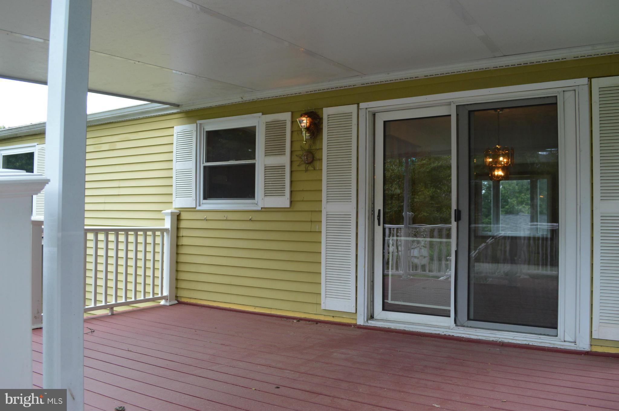 8604 Cottington Road Baltimore, MD 21236 - Photo 15 of 22 Covered deck off the dining room
