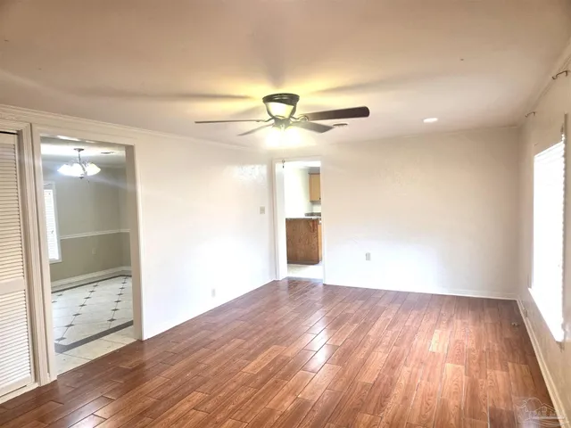 a kitchen with a stove sink and cabinets