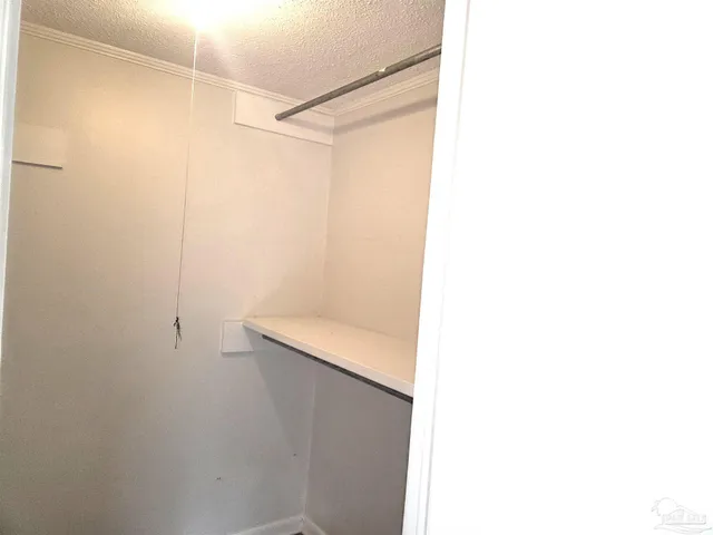 a bathroom with a granite countertop sink and window