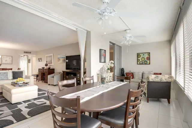 a living room with fireplace furniture and a flat screen tv