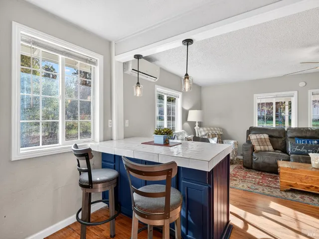 a view of a dining room with furniture window and wooden floor