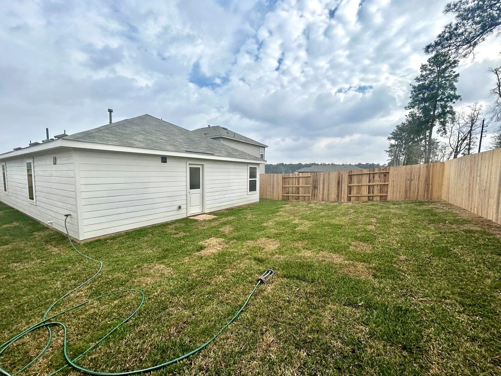 438 Southern Magnolia Way Magnolia, TX 77354 - Photo 15 of 18 a front view of a house with garden