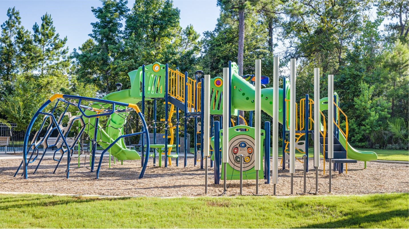 438 Southern Magnolia Way Magnolia, TX 77354 - Photo 17 of 18 a view of a park with swings and slides