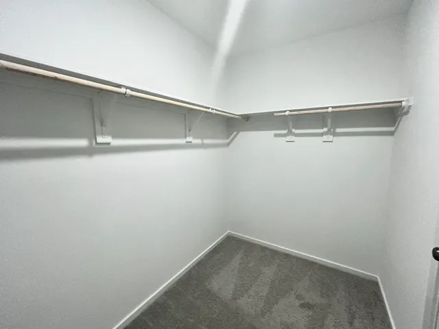 a view of an empty walk in closet