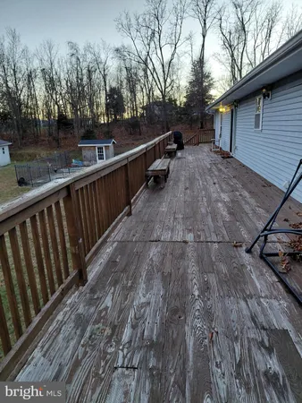 a view of balcony with wooden floor