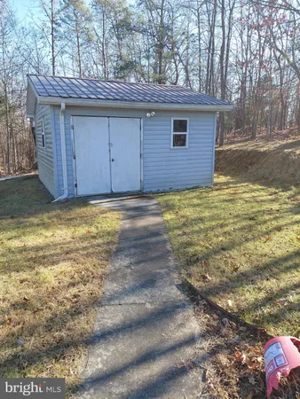 a view of a wooden deck with a yard