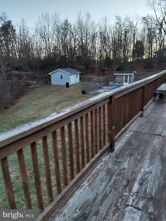 a view of balcony with outdoor space and wooden floor
