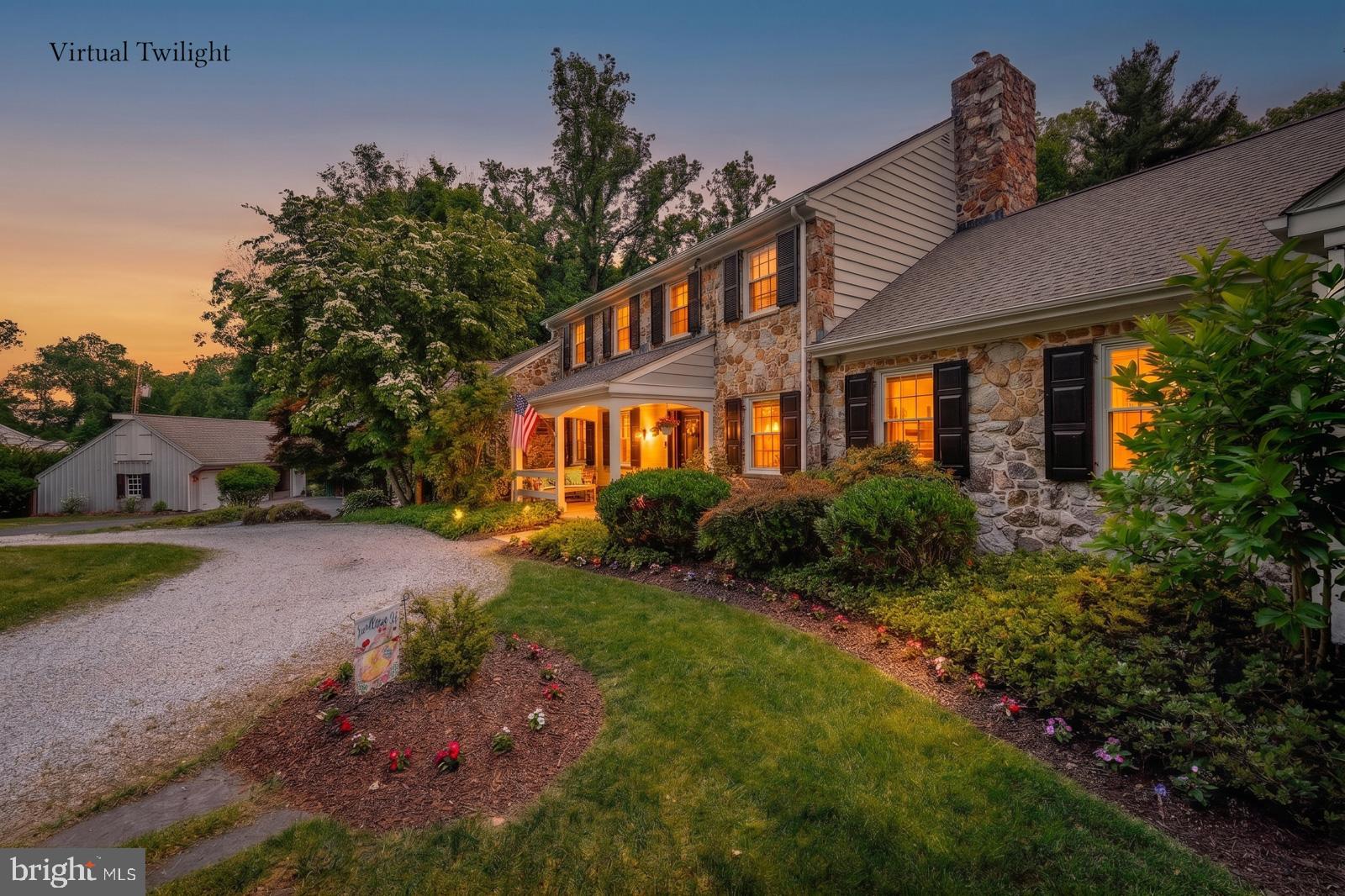 1700 Old Welsh Road Huntingdon Valley, PA 19006 - Photo 4 of 105 a front view of a house with a yard and outdoor seating