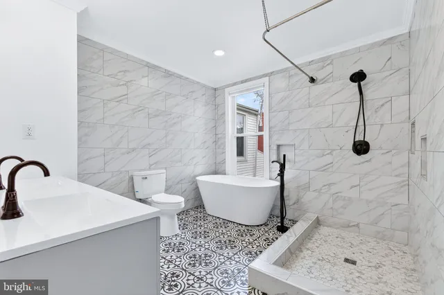 a bathroom with a sink a vanity and a mirror
