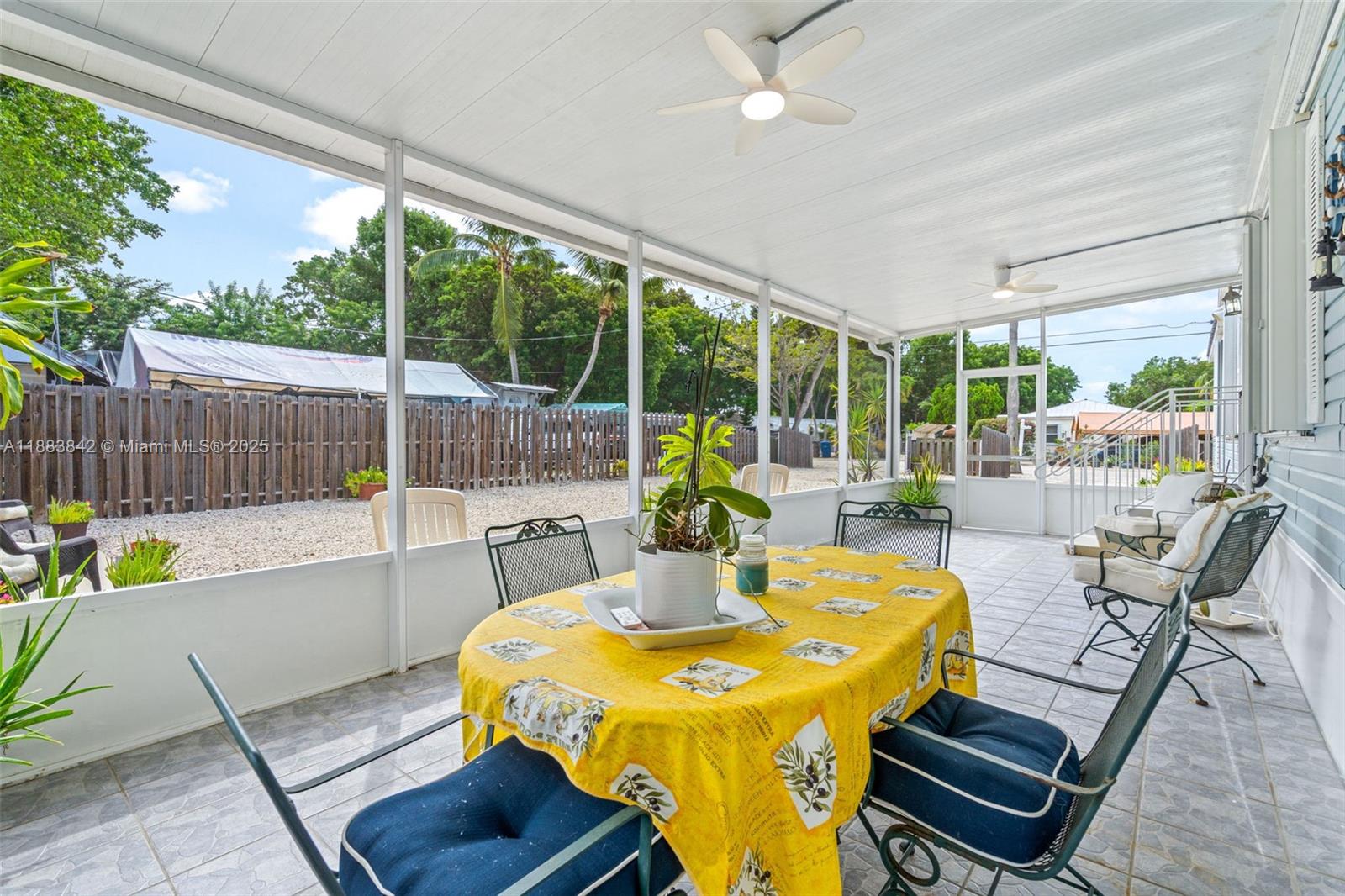 278 King Avenue Key Largo, FL 33037 - Photo 11 of 58 a view of a dining tables and chairs in the patio