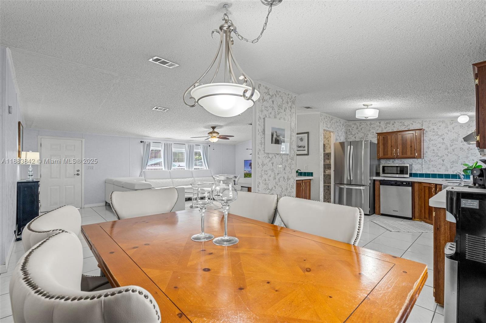 278 King Avenue Key Largo, FL 33037 - Photo 20 of 58 a dining room with furniture and a kitchen view