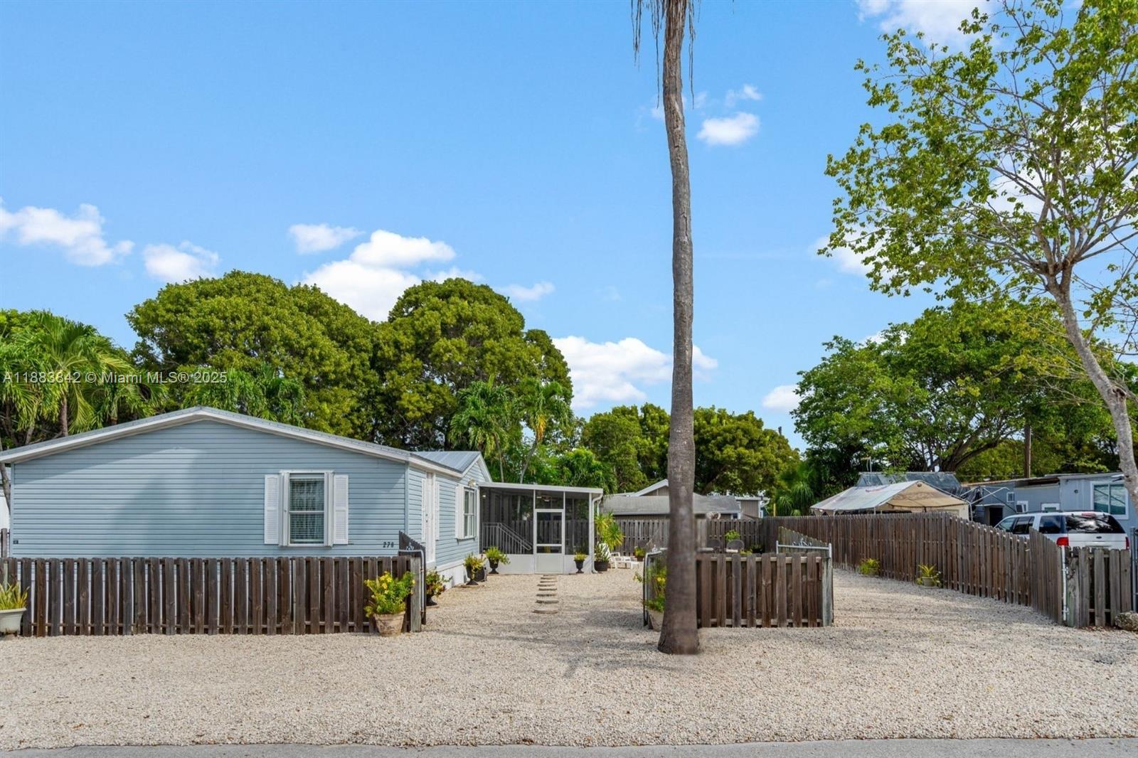 278 King Avenue Key Largo, FL 33037 - Photo 2 of 58 a view of a house with a patio